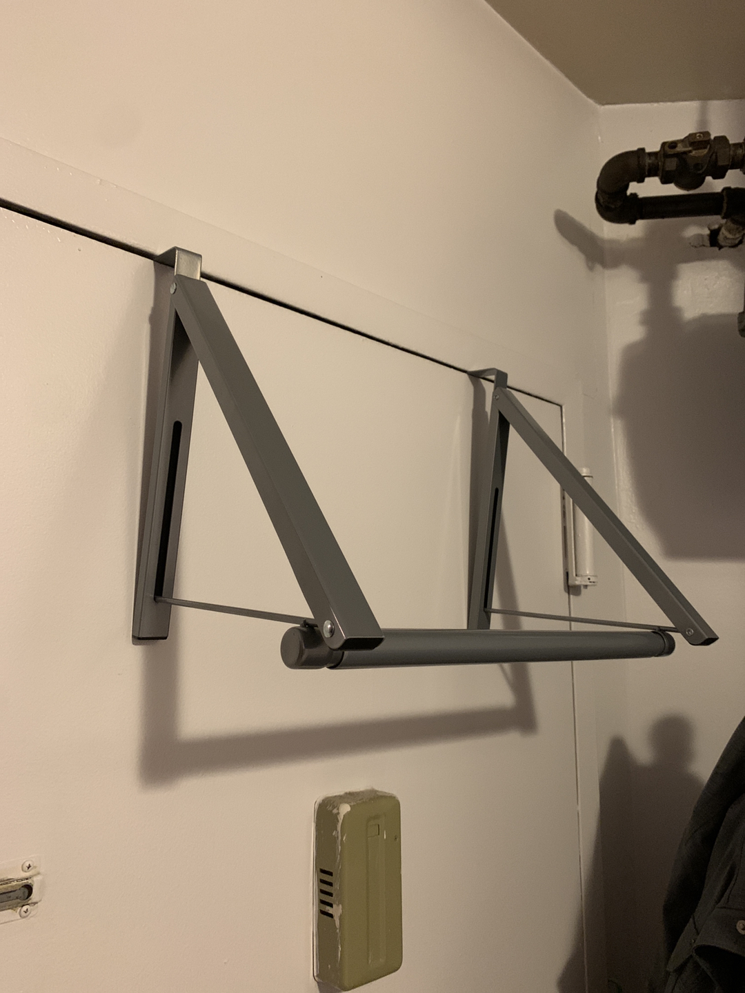 Clothing rack - hangs from door and collapses 