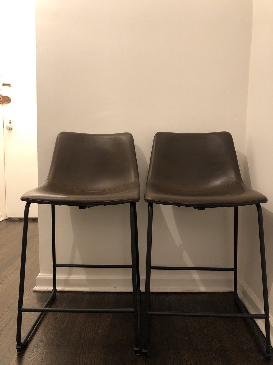 Brown leather stools (set of two)