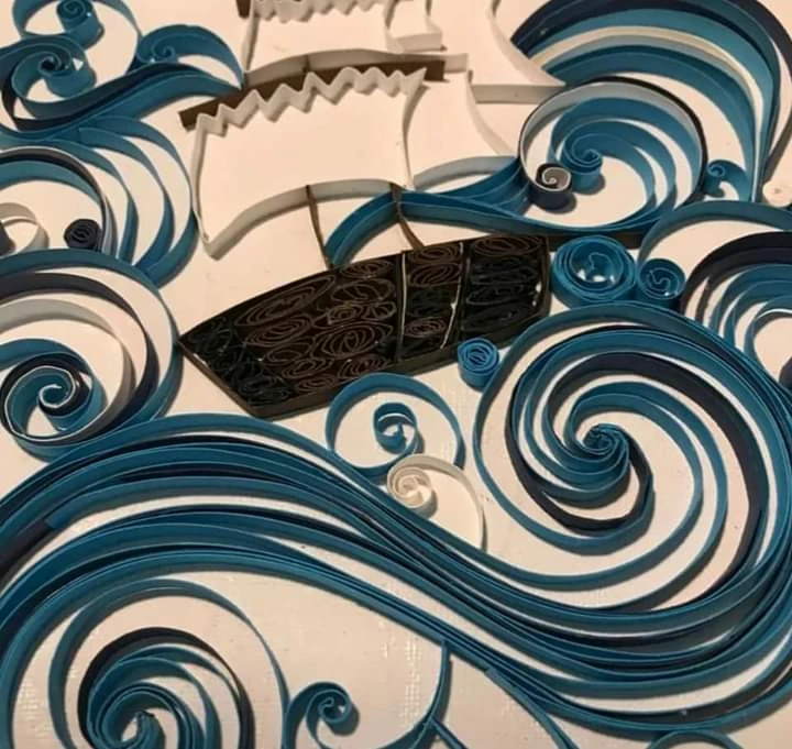Boat between waves made with technique quilling - photo 2