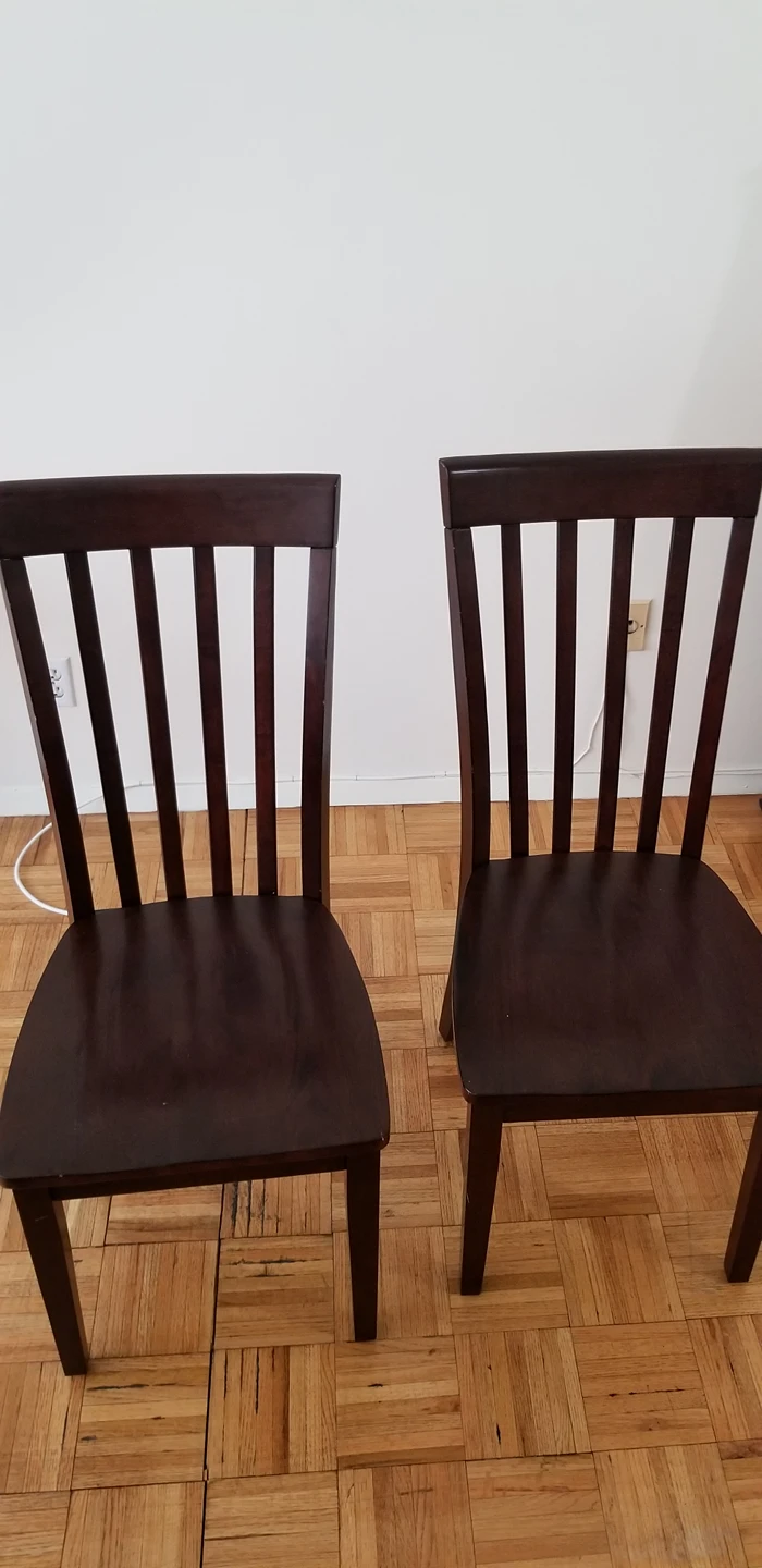 two wooden dining chairs
