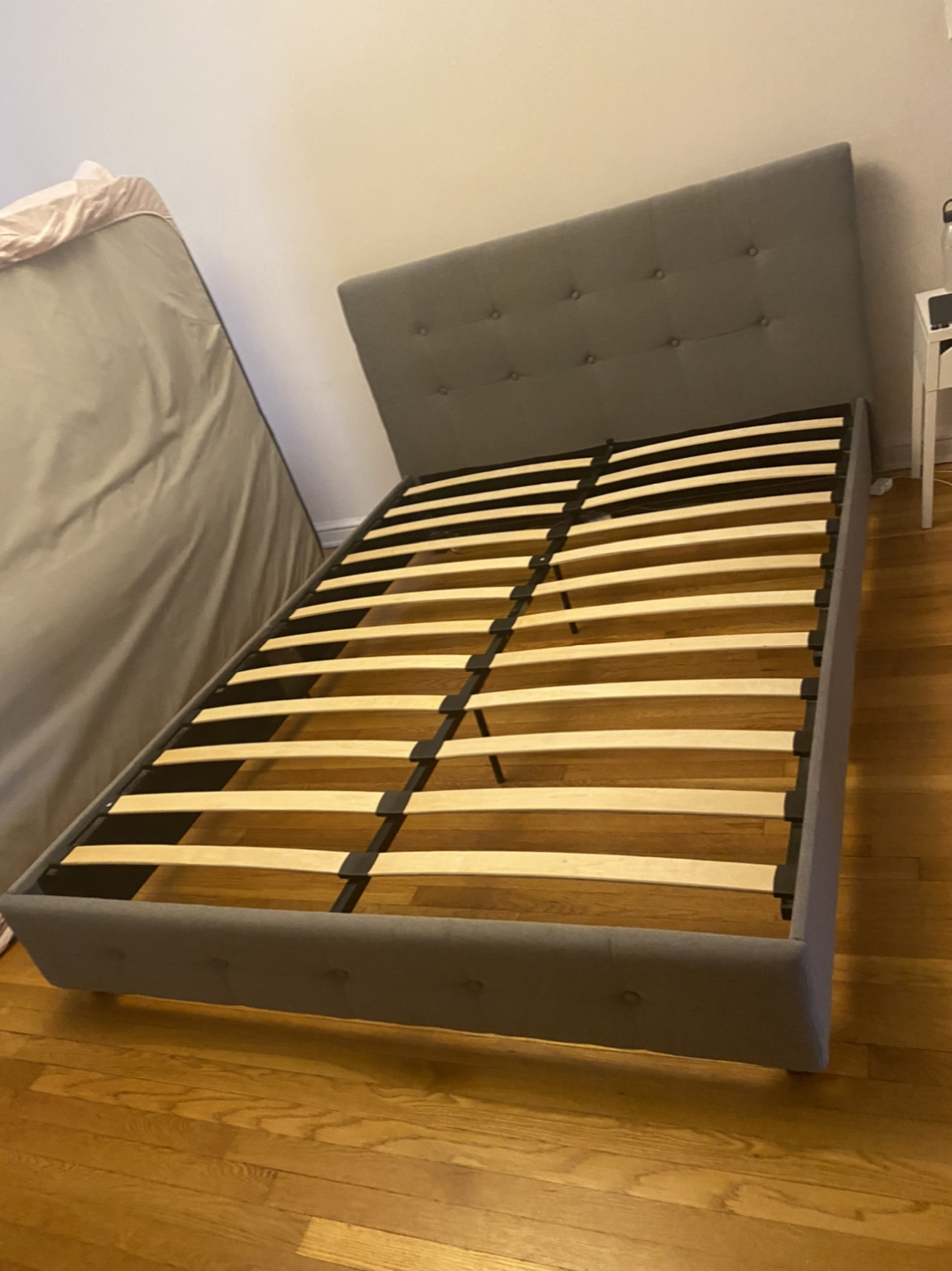 Grey upholstered queen bed frame