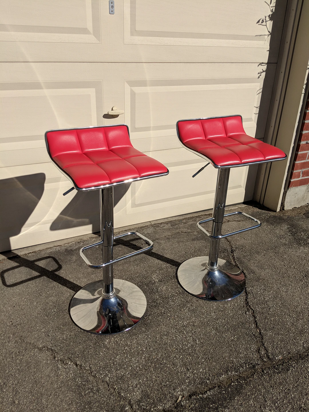 Pair of faux leather red bar stools