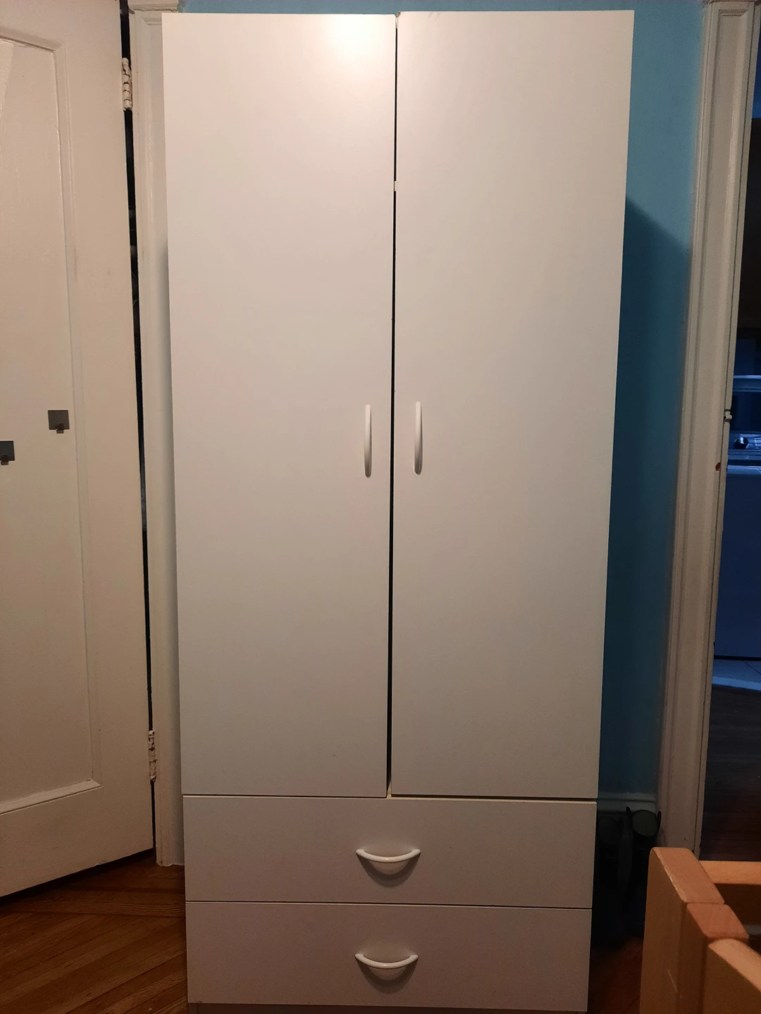 white wooden armoire
