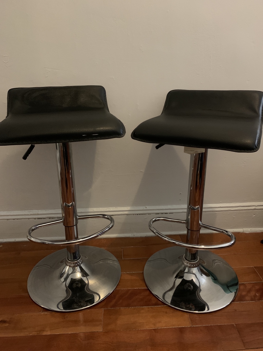 Two black bar stools 