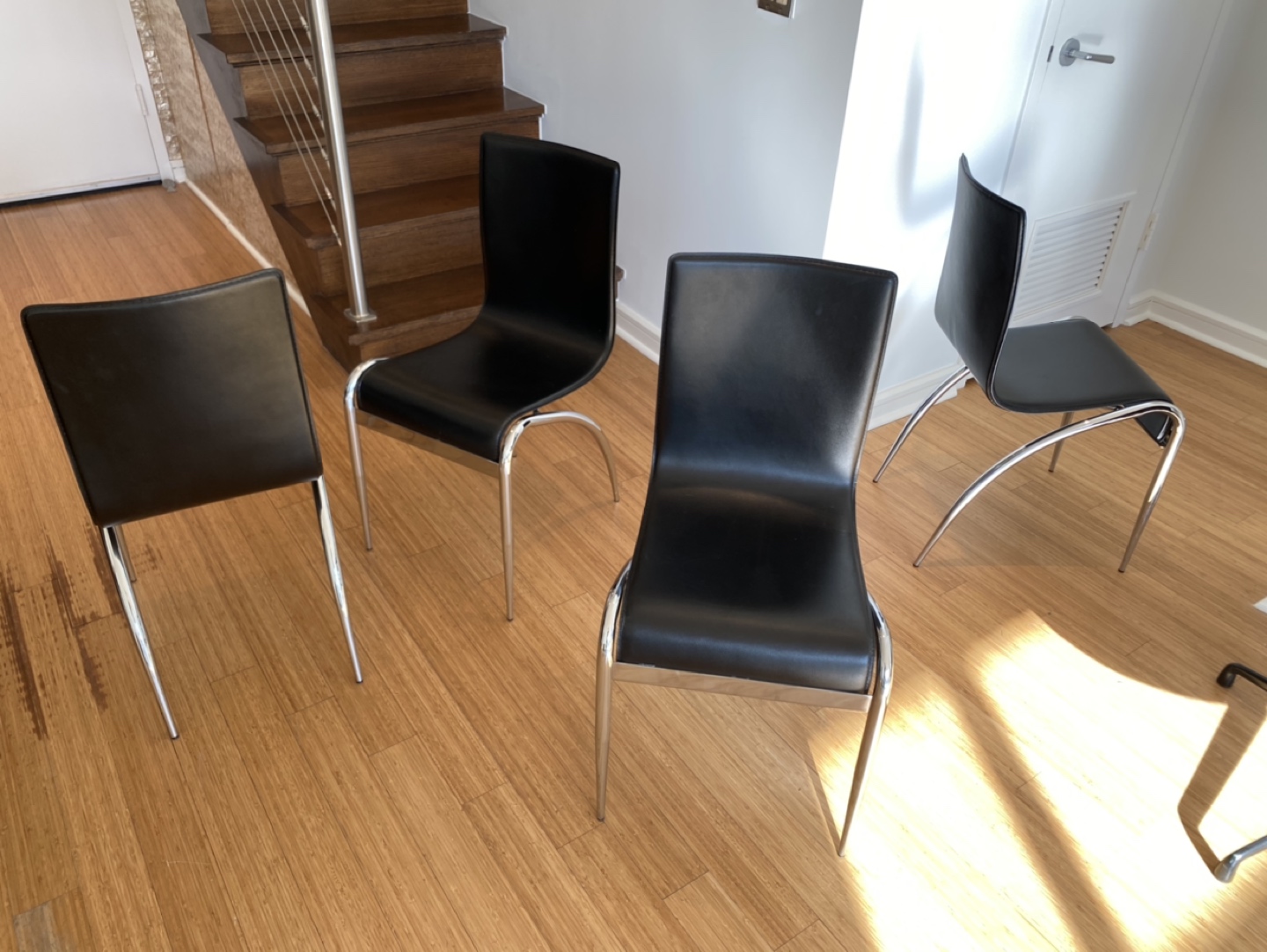 Black leather and silver chairs set of 4. Sling back.