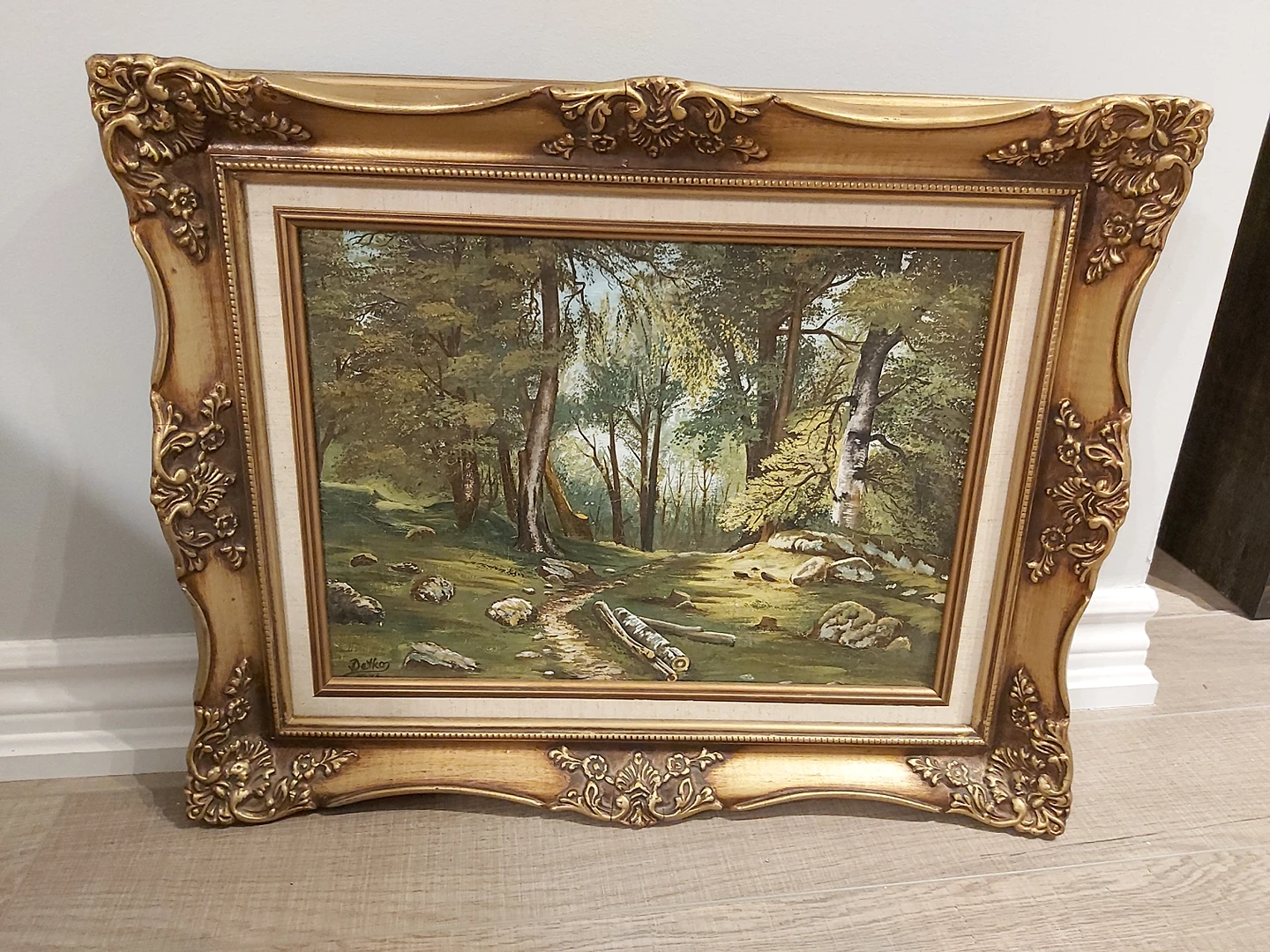Painting in a beautiful gold frame thumbnail