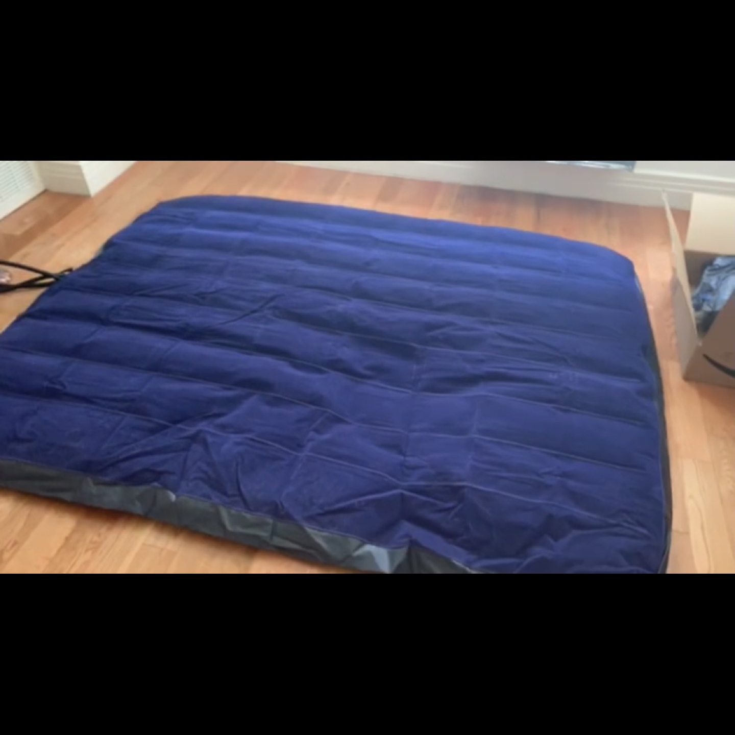 Air mattress with pillows and a pump