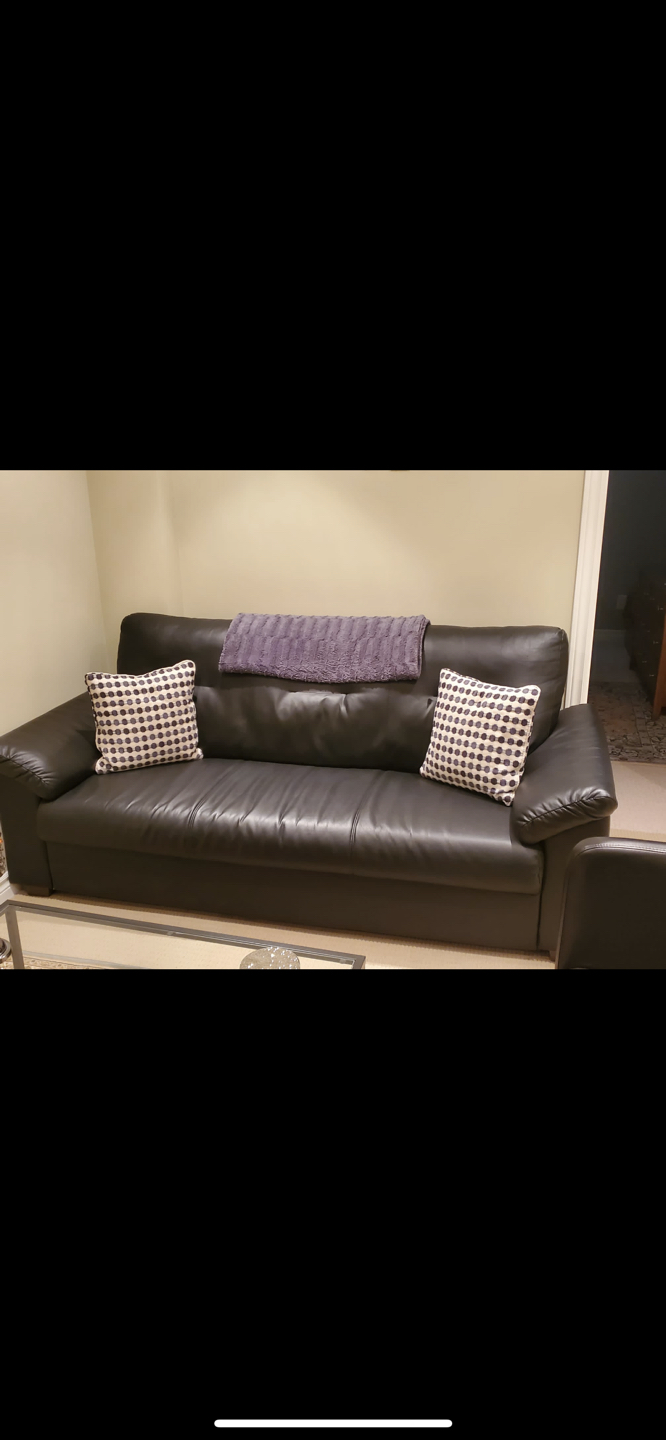 Black leather couch with pillows and armchair  thumbnail