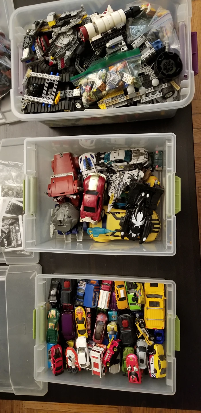 Lego pieces, transformers, toy cars