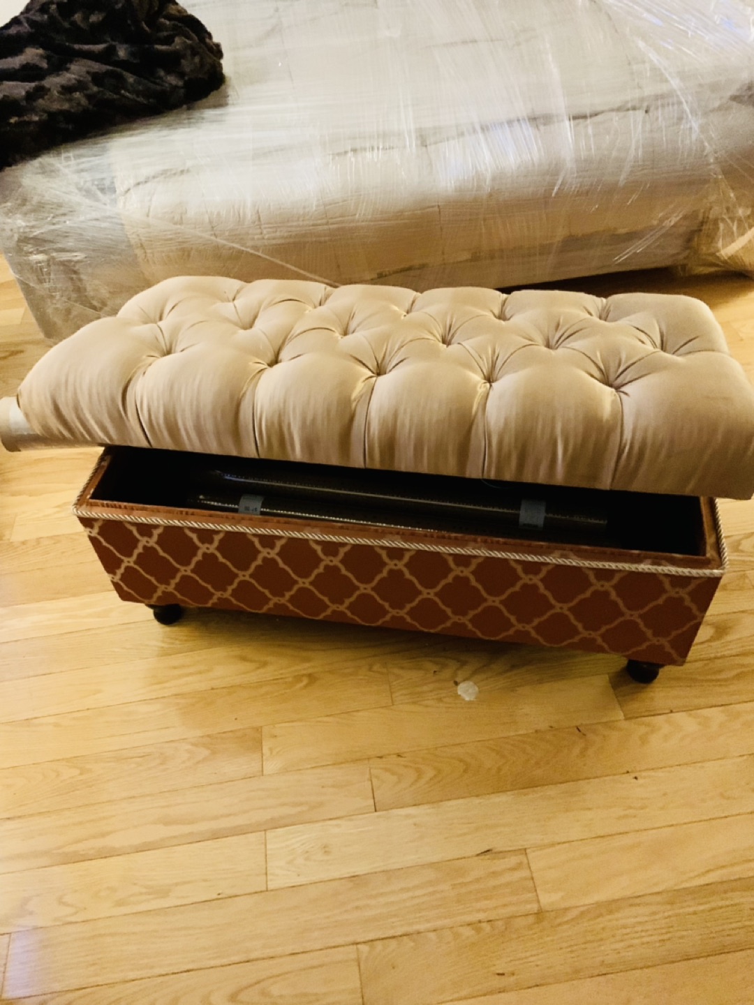 Upholstered storage ottoman. Approx 48x24x24