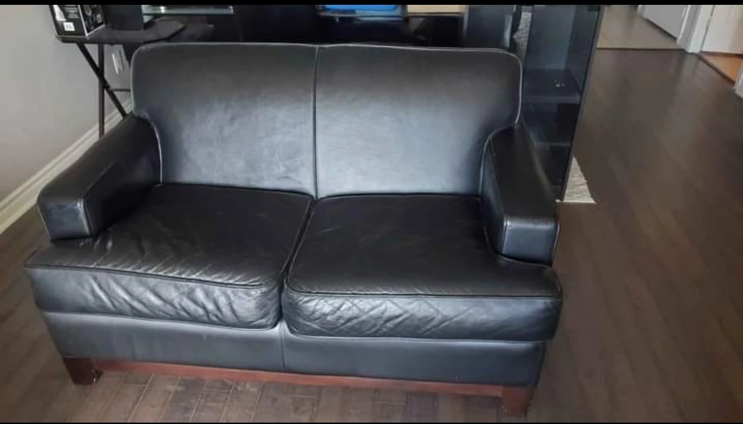 Great Condition  Black Leather Loveseat