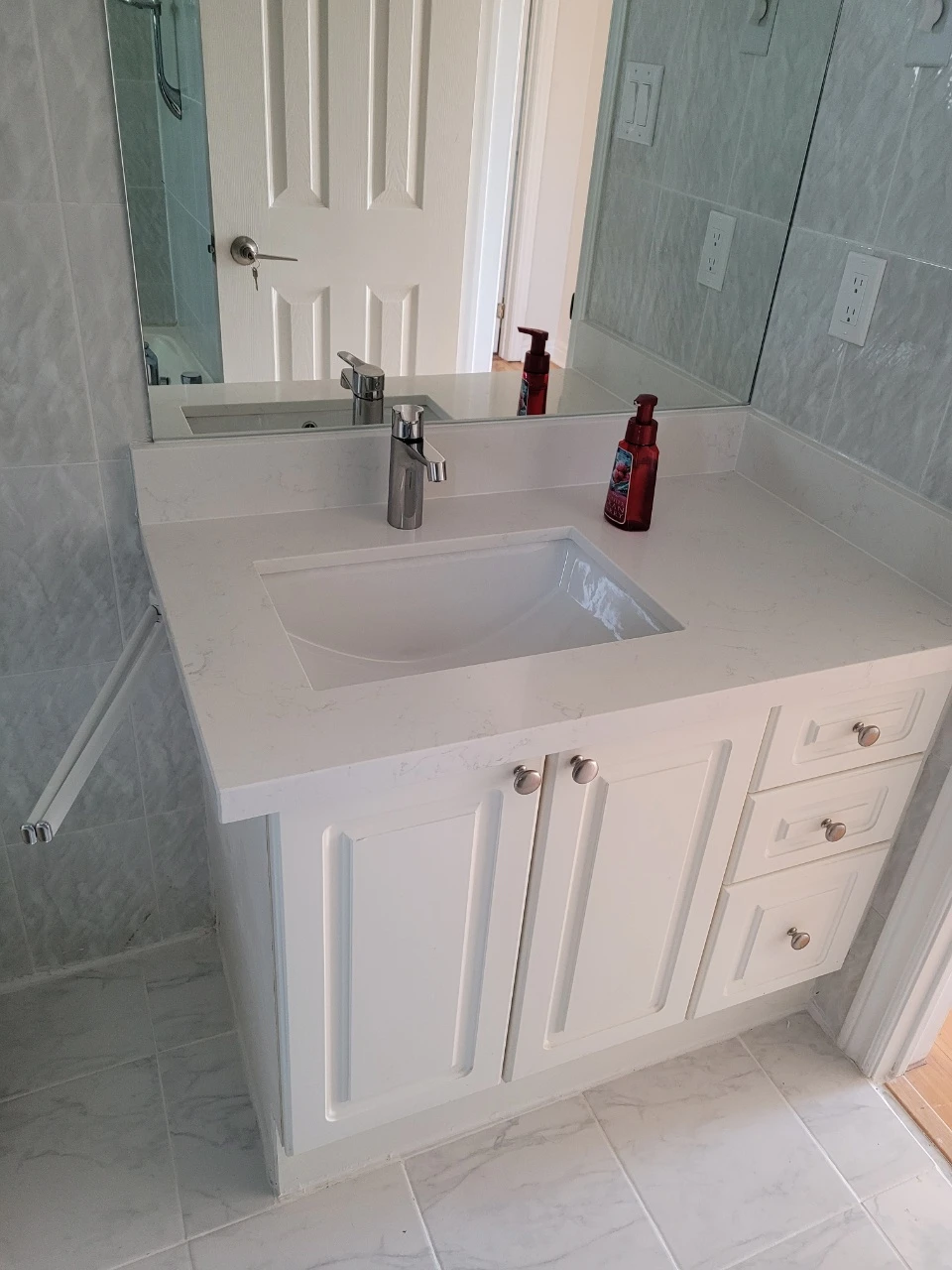 bathroom vanity, sink, faucet, countertop, and the lighting - photo 2