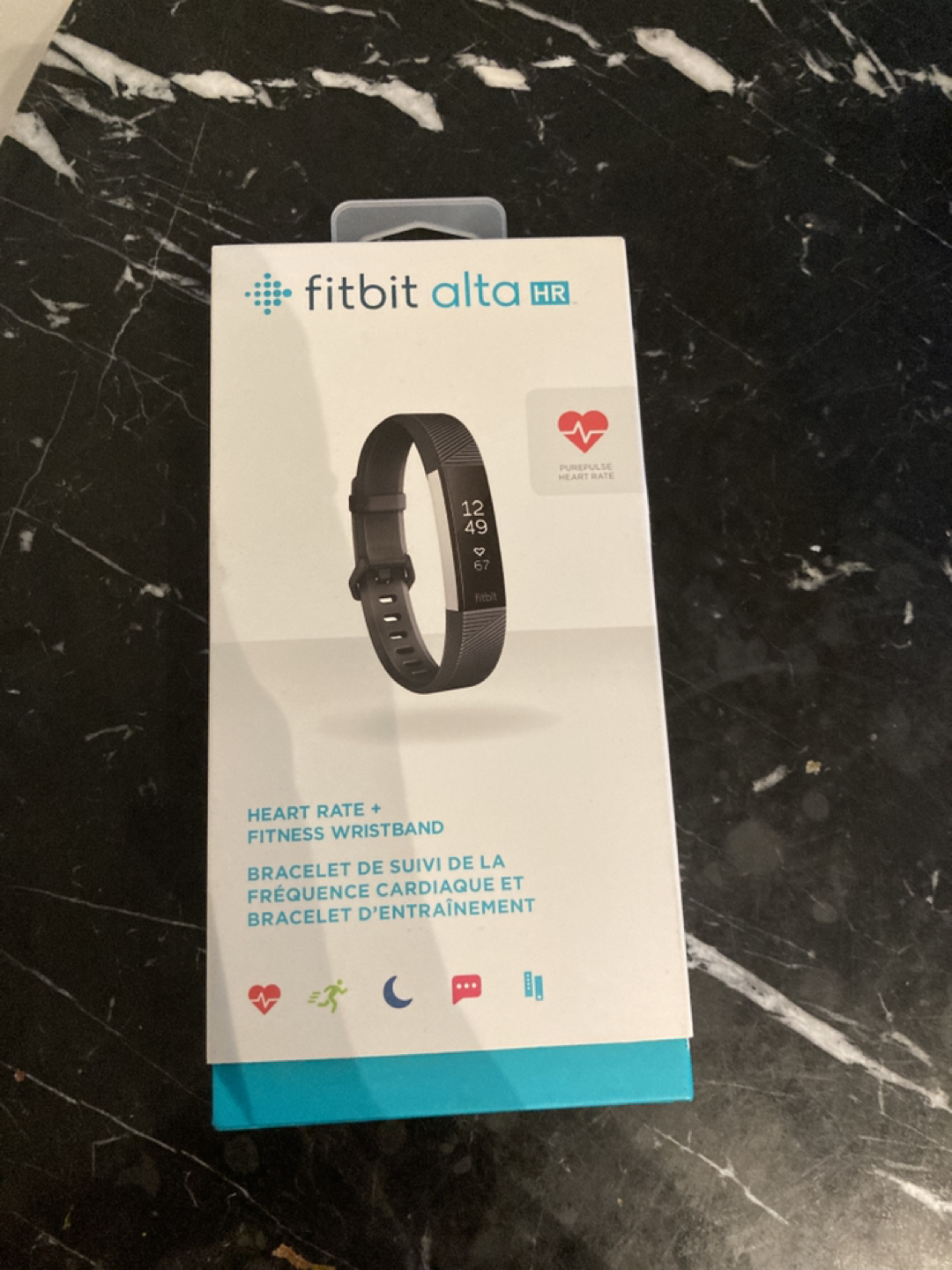 Gifted, never used Fitbit Alta HR.