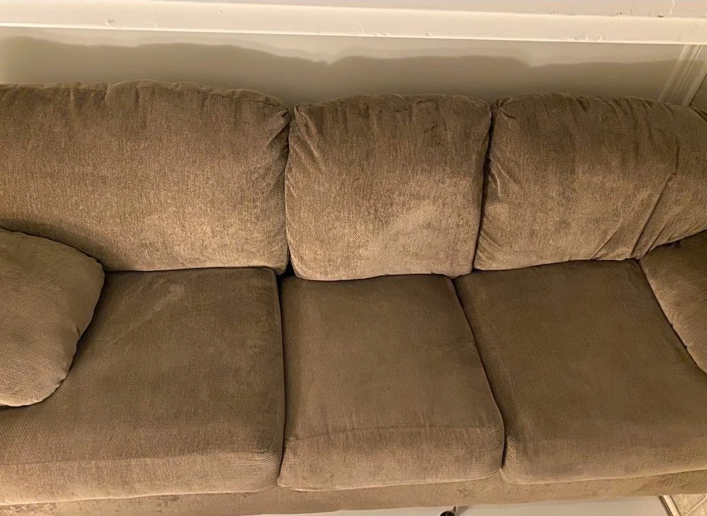 super comfy beige couch + ottoman Ashley furniture