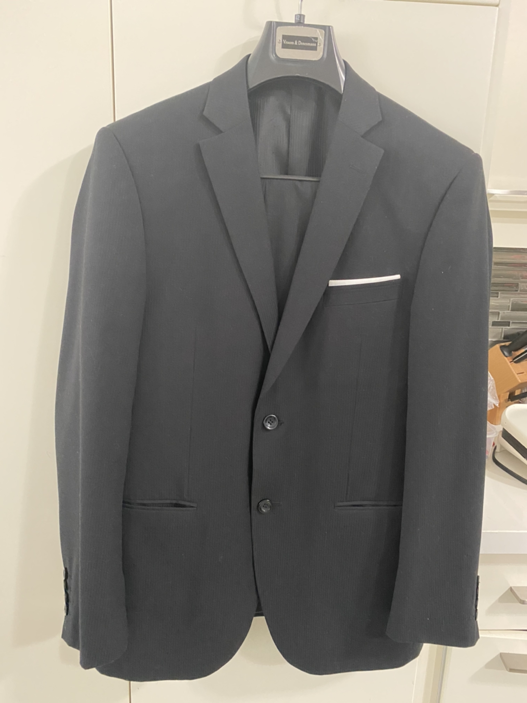 Man’s black suit thumbnail