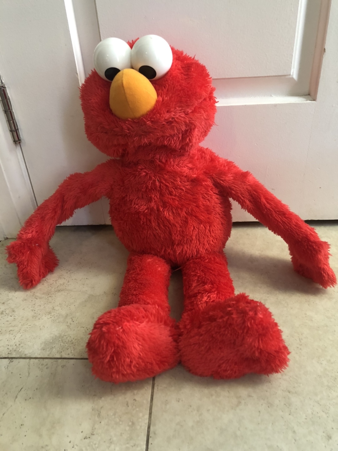 Elmo hugs toy
