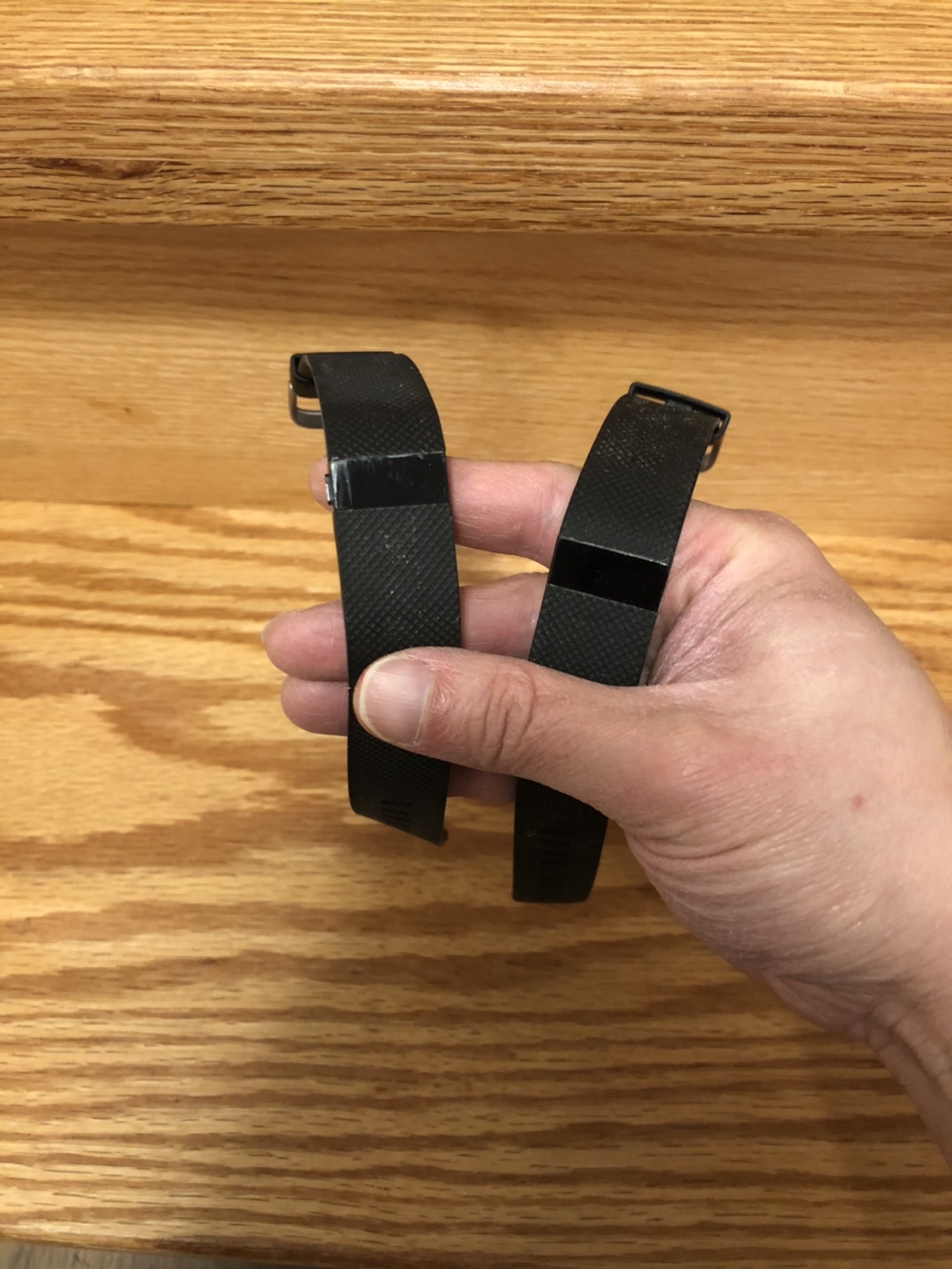 2 older generation fitbits