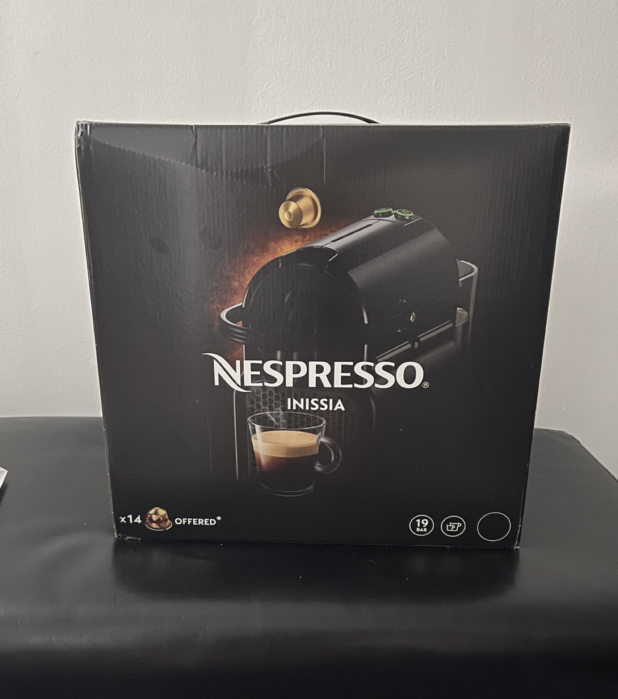 Brand New Inissia Nespresso machine in box with capsules.