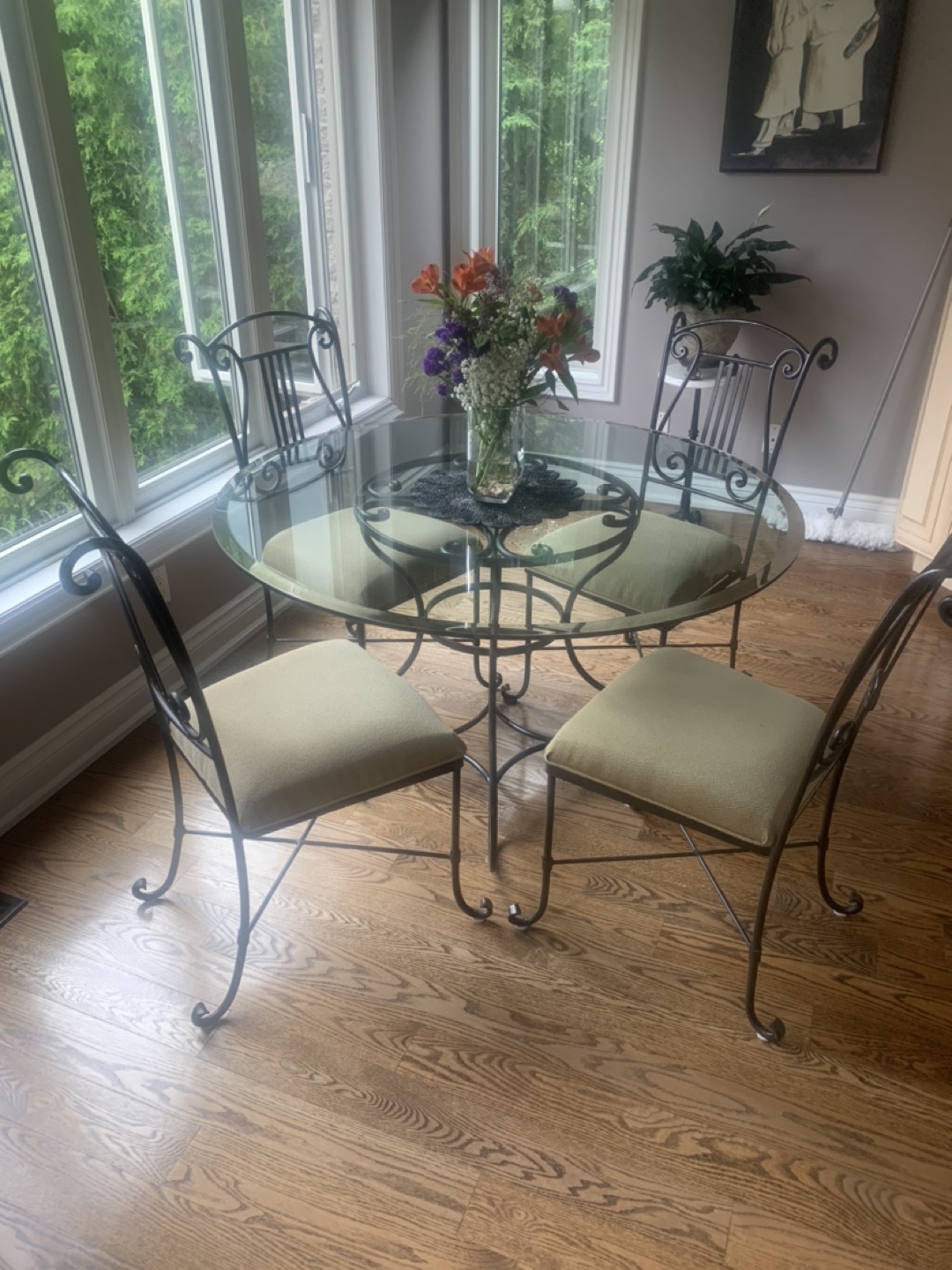 ONE WROUGHT IRON GLASS TABLE & FOUR CHAIRS