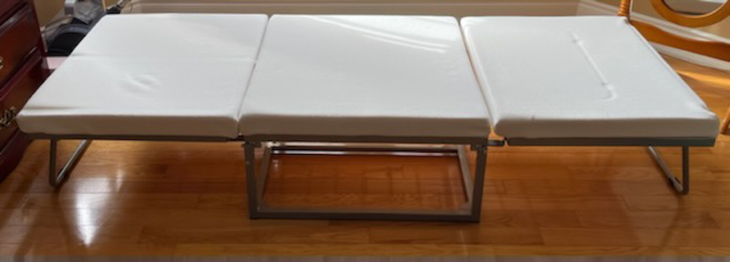Stowaway folding bed
