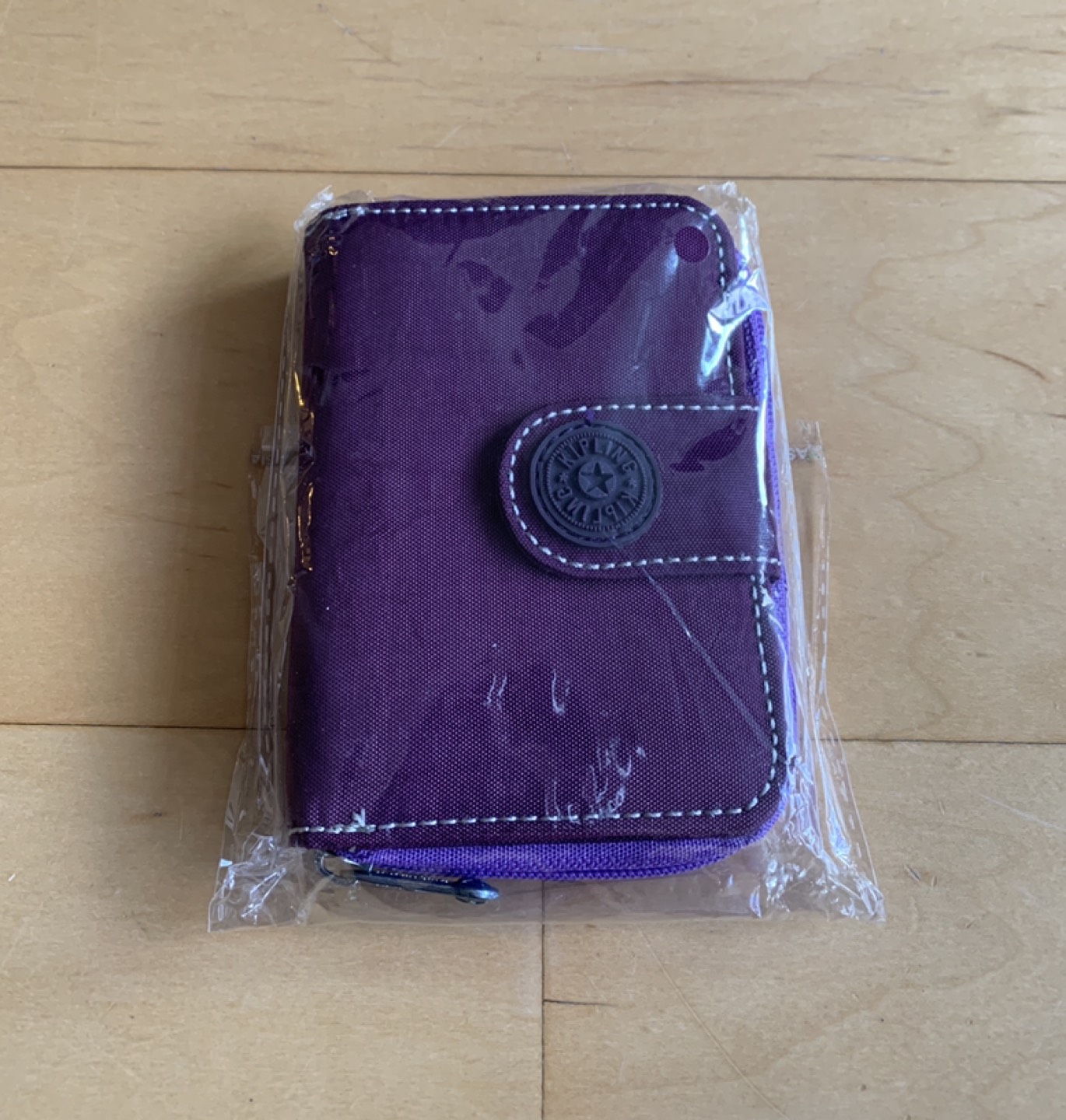 Brand new gifted/unused pocket size purple wallet
