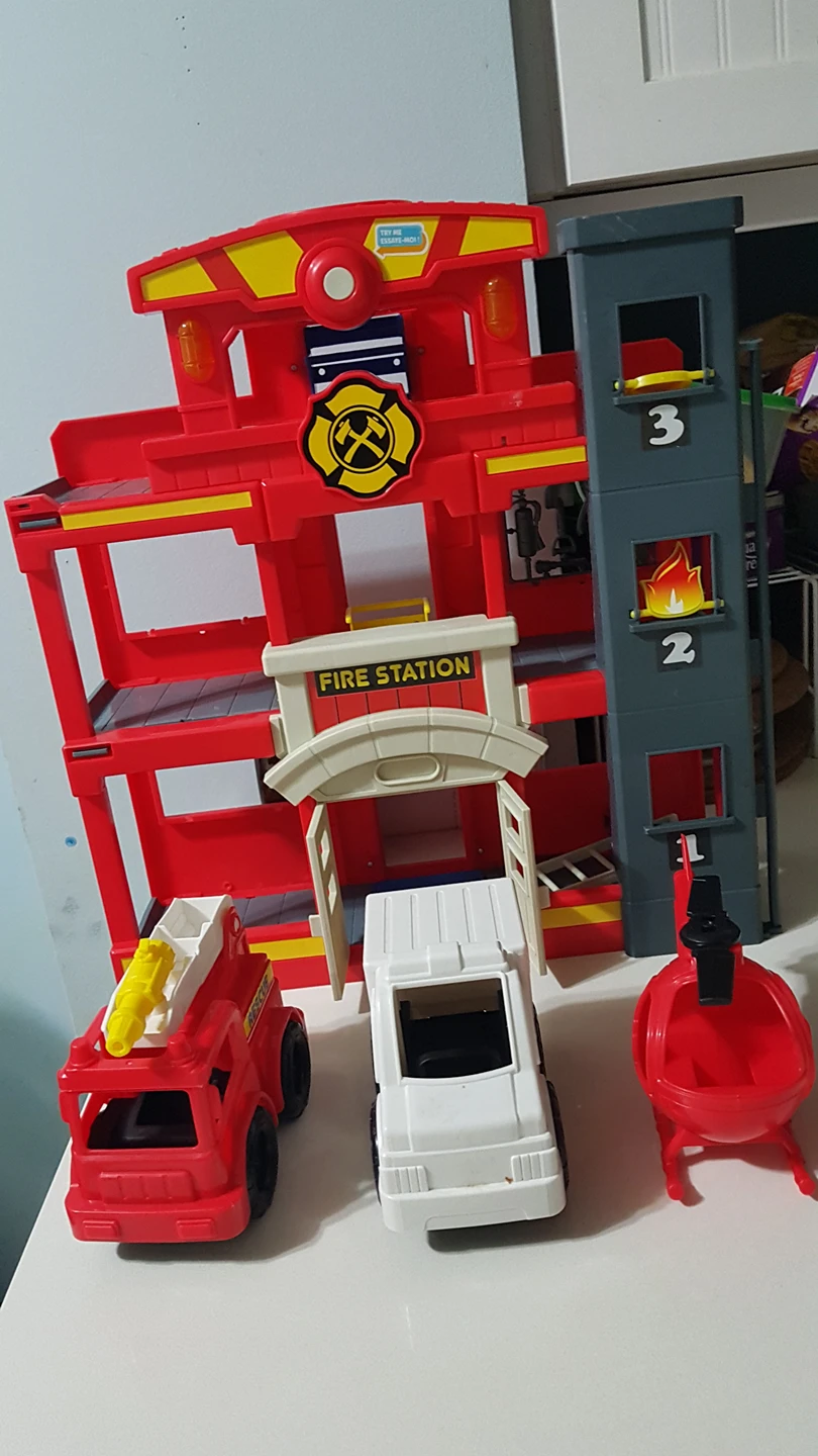 Fire station with fire truck, ambulance, and helicopter. thumbnail