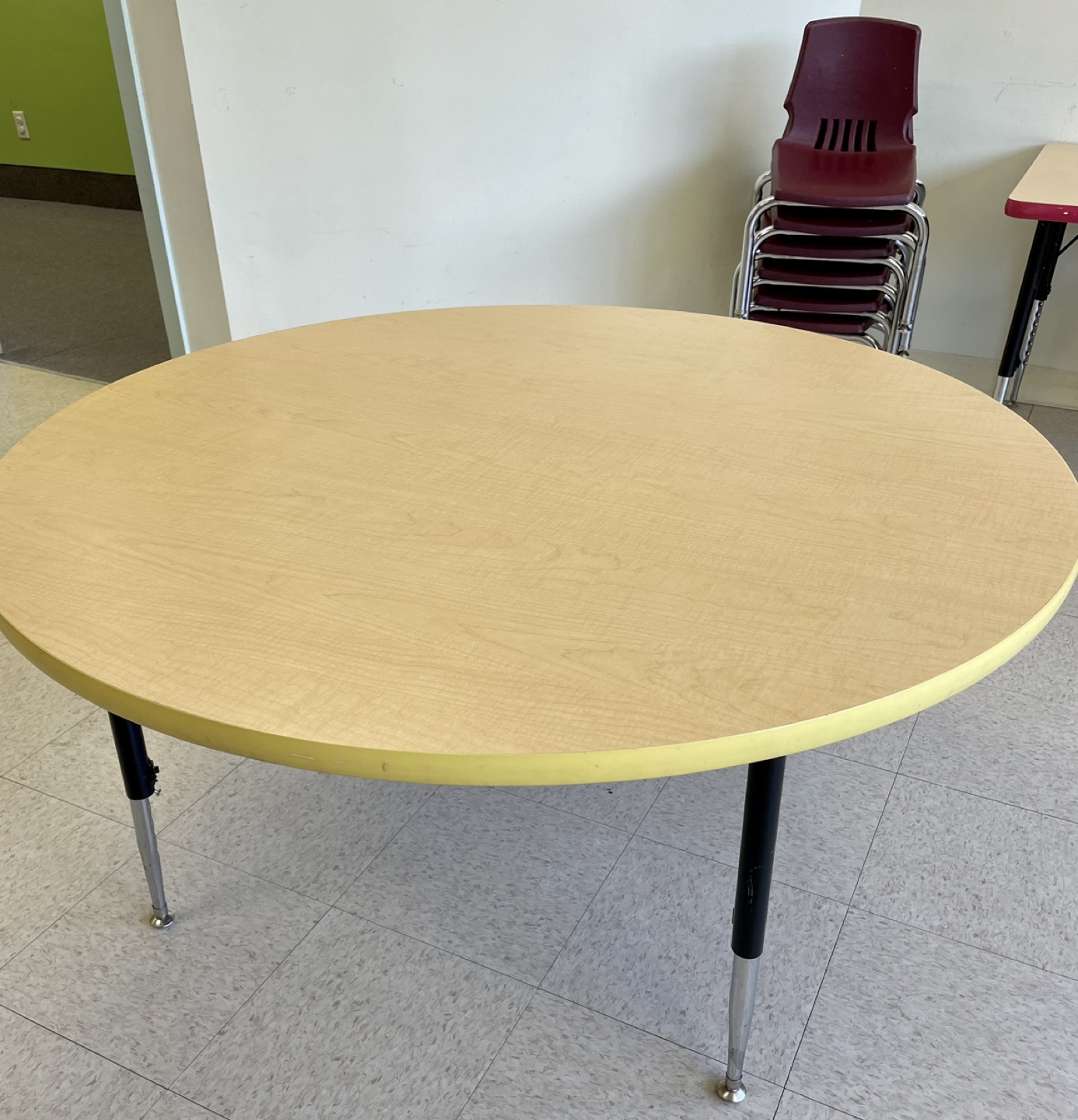Adjustable table, round maple with yellow , 48” x 25H.