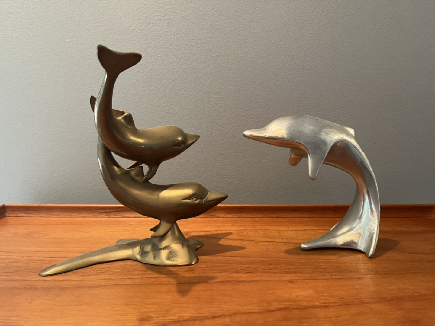 Brass and steel dolphins thumbnail