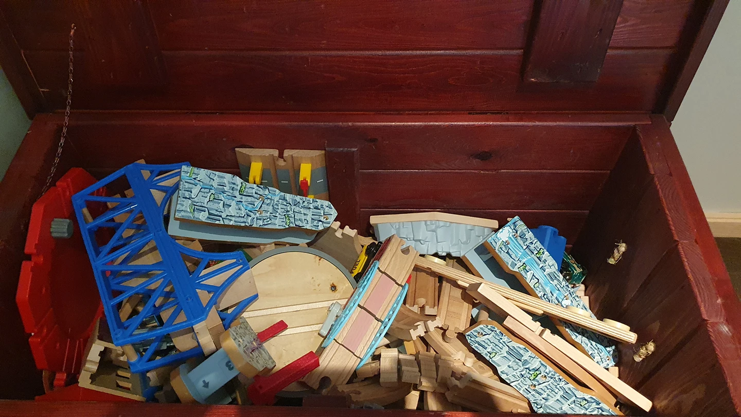 a huge trunk of Thomas train tracks
