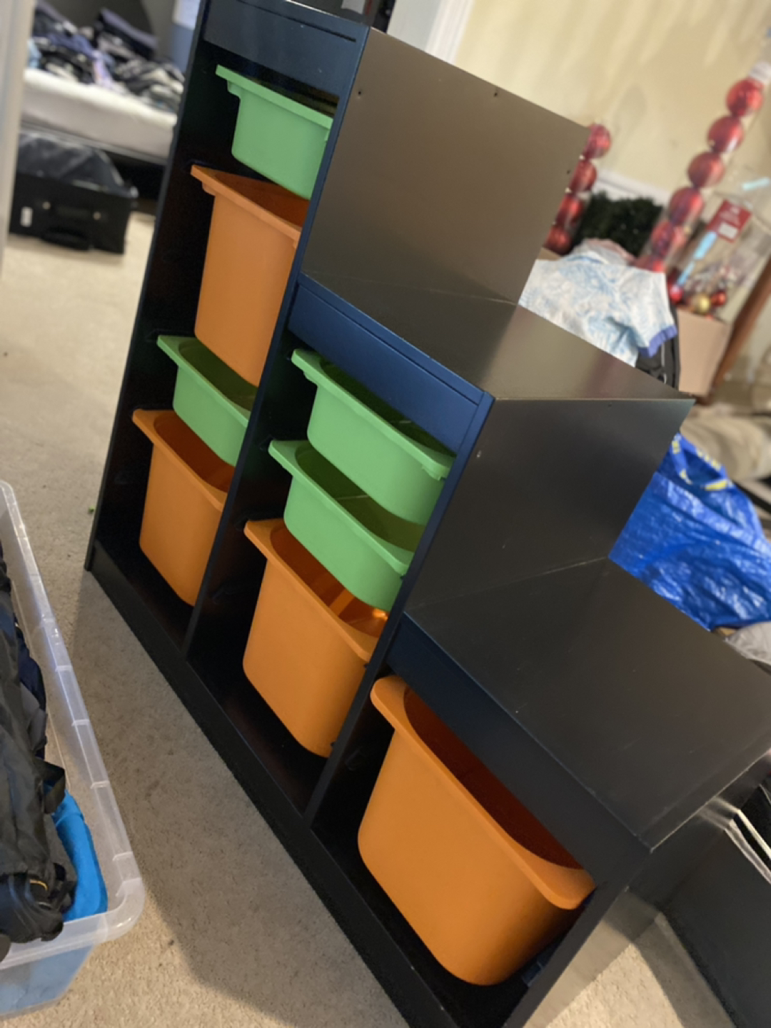 Storage combination with boxes orange and green.