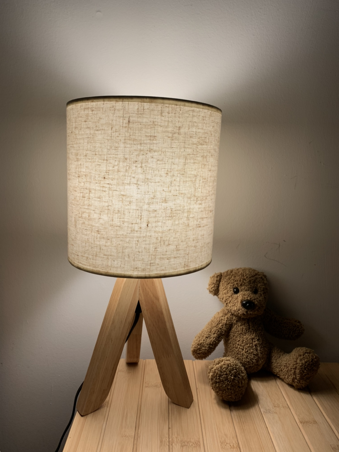 Bedside table lamp with linen cover and wood base thumbnail