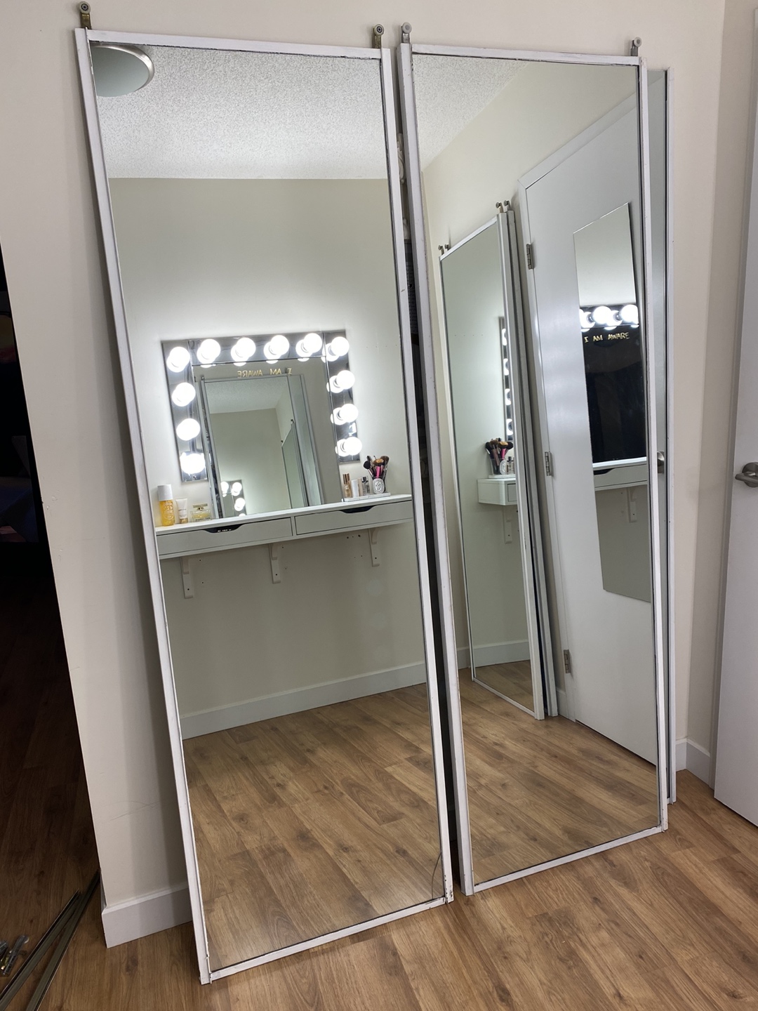Four 24” x 79” mirror sliding doors with hardware