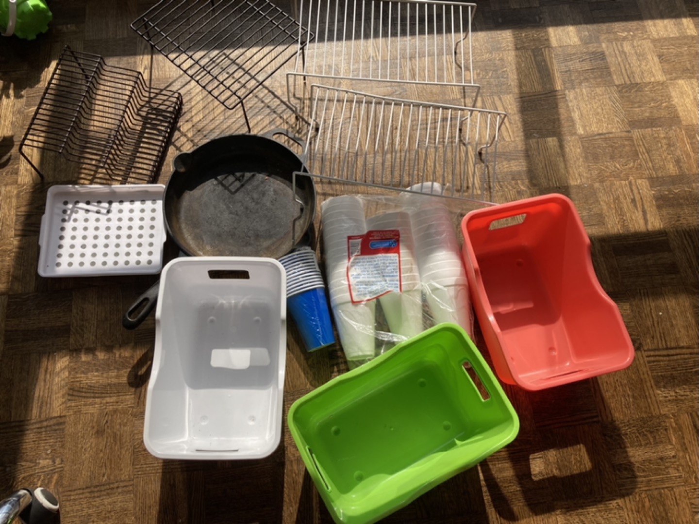 Assorted shelves, baskets and an iron skillet