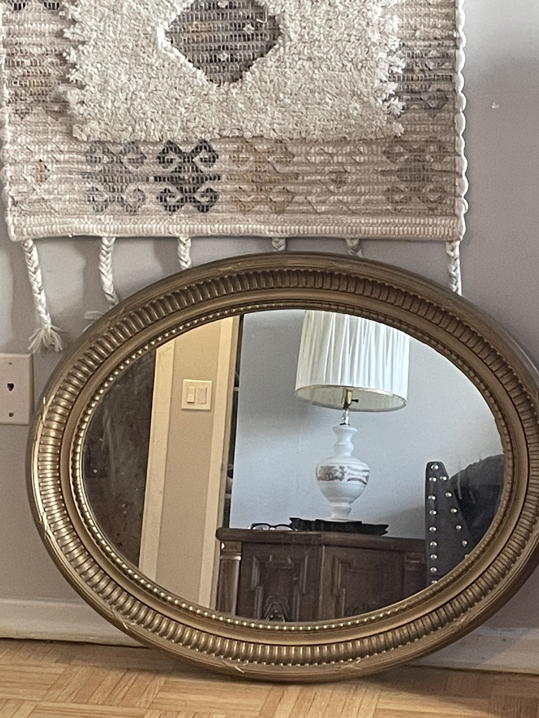 Oval gold mirror
