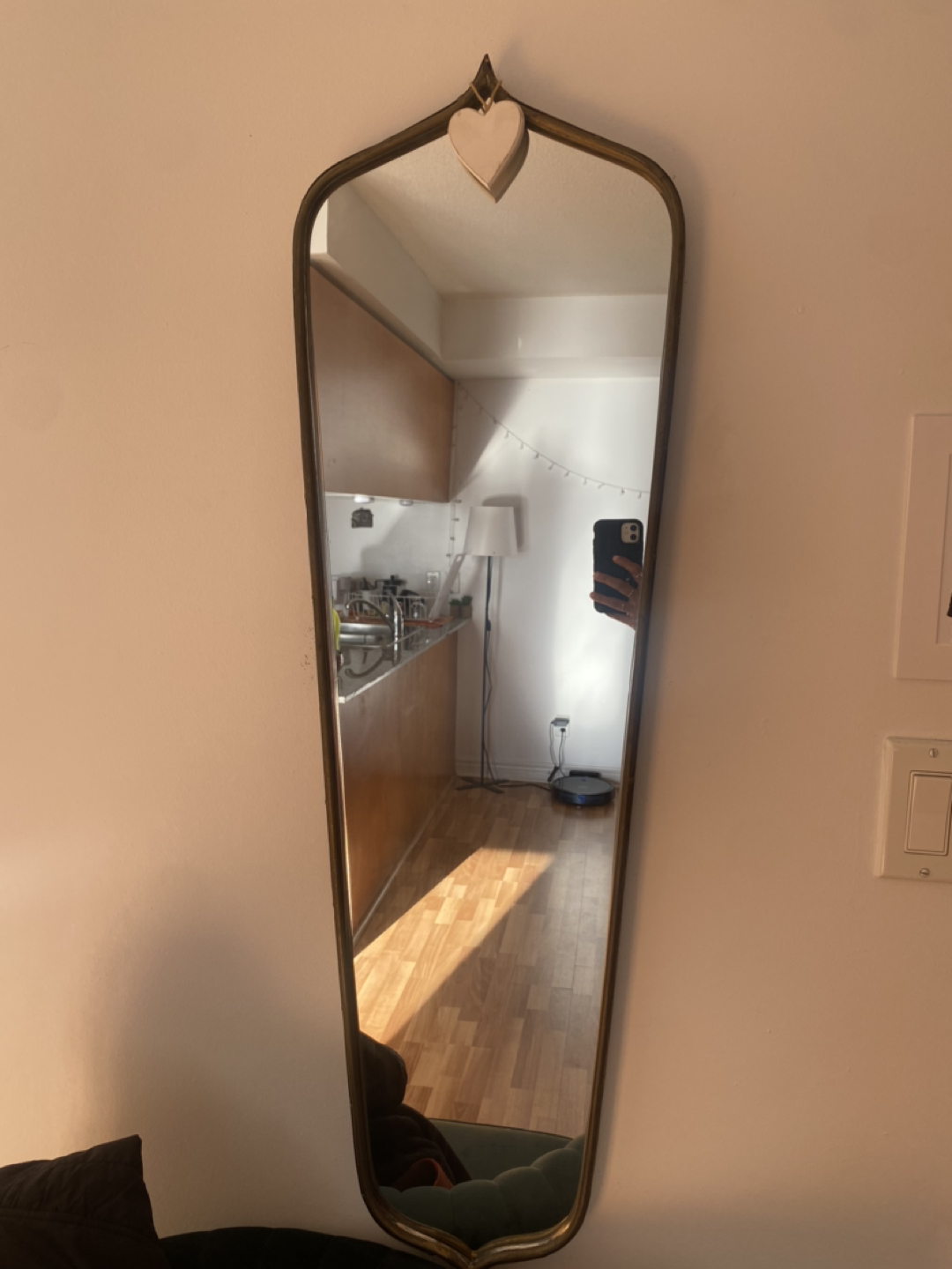 Mirror with golden metal frame