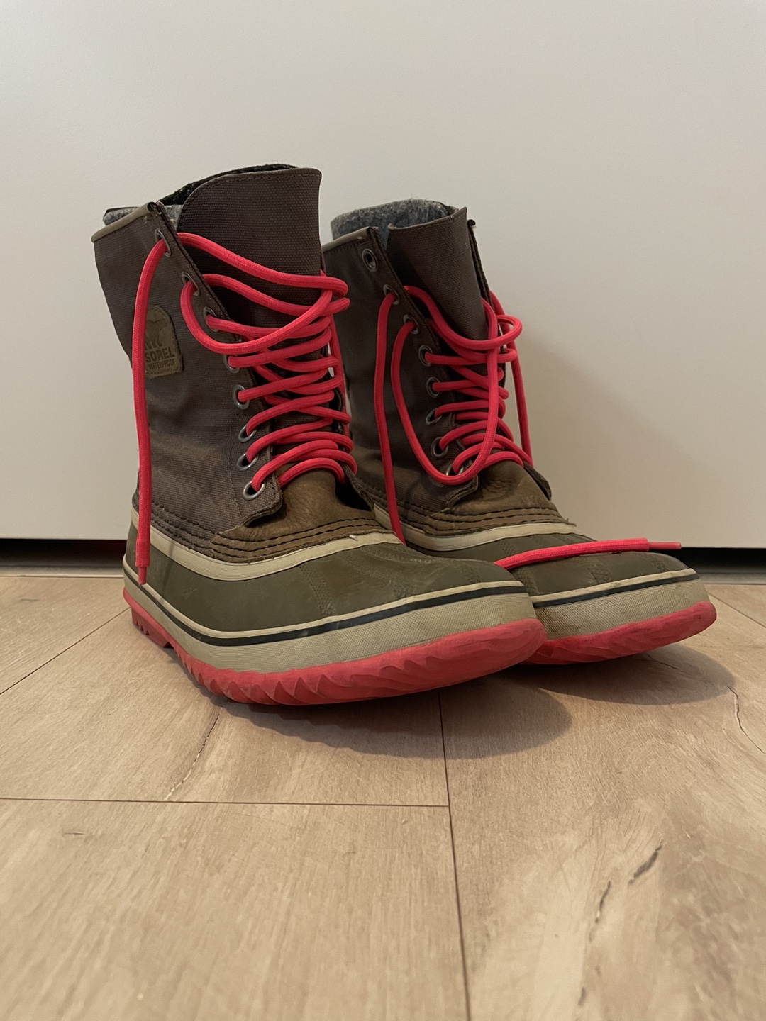 Women’s brown and pink Sorel boots thumbnail