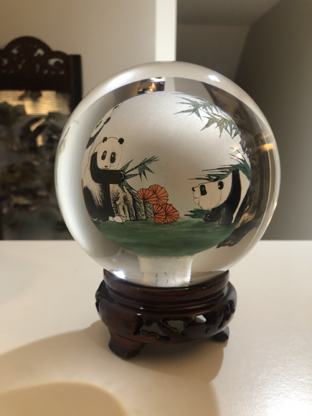 Glass globe with pandas drawn inside. image indicator(2)