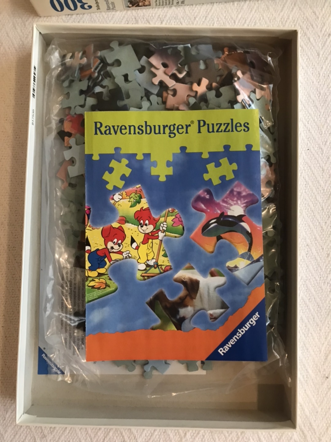Two (2) Ravensburger Puzzles • 1 New (300 pieces) • 1 Used image indicator(2)