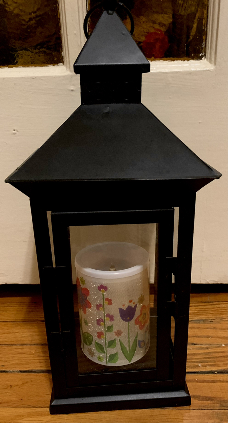 Decorative metal lantern with light