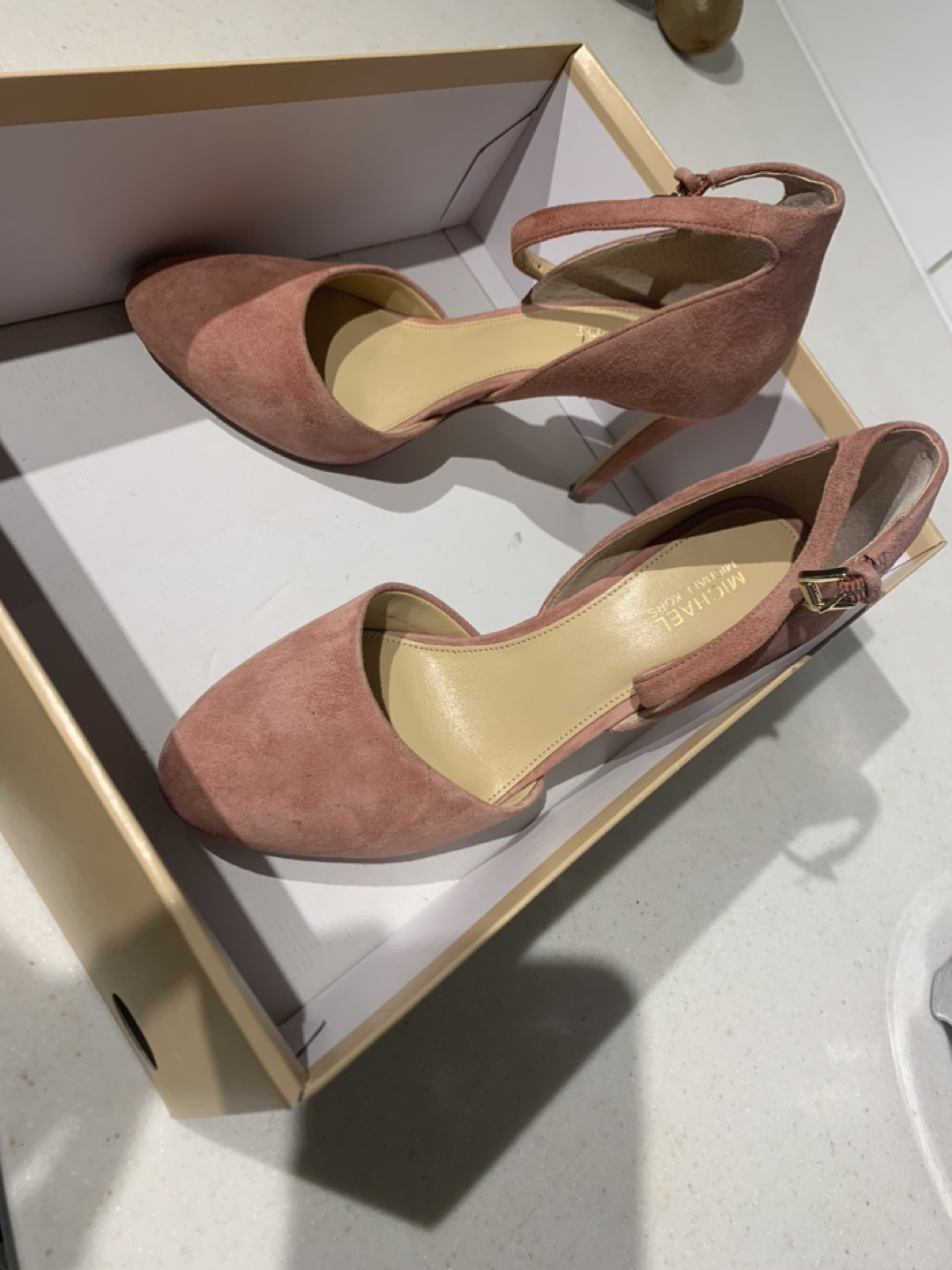 Micheal Kors sued pink shoes thumbnail