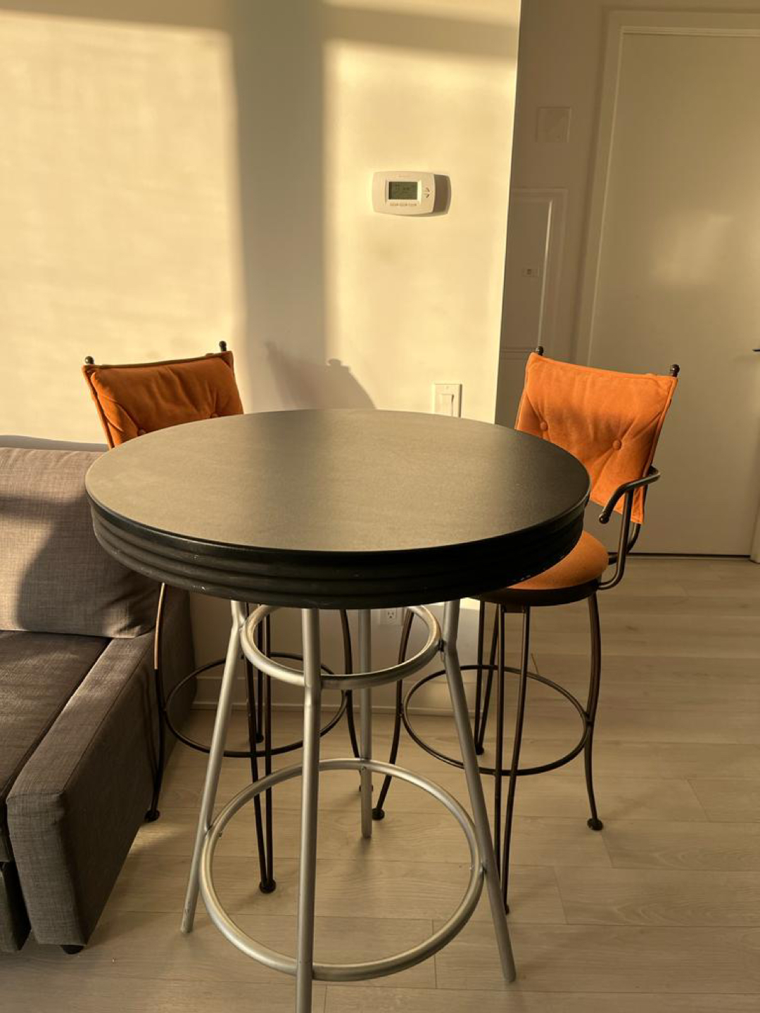 Stylish dining table with three highchairs