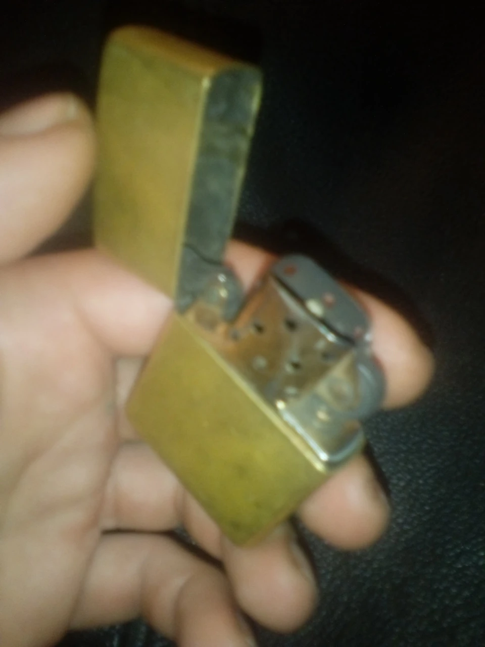 Brass/Gold colored 2000 Zippo brand lighter XVI