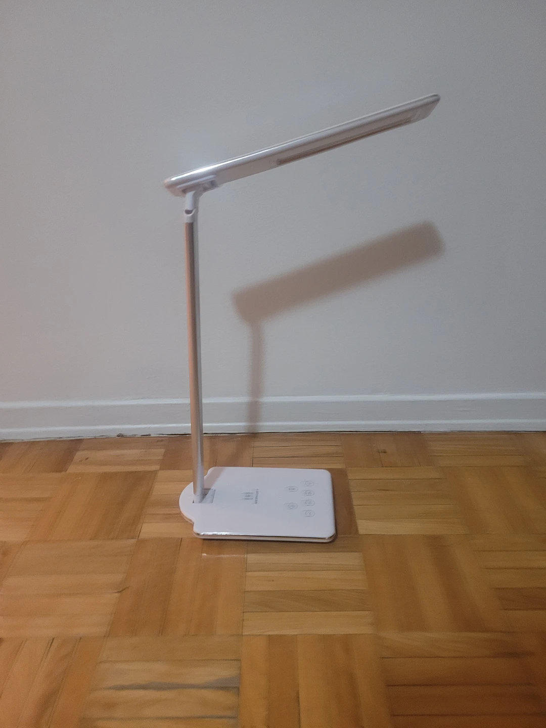 LED lamp with wireless charging station