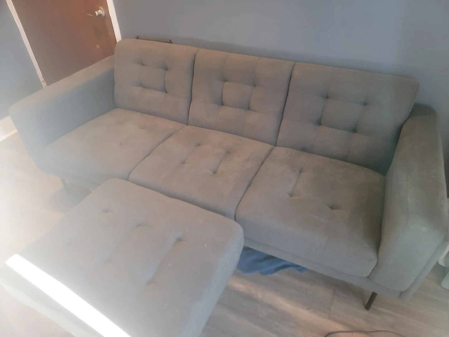 couch with separate leg rest