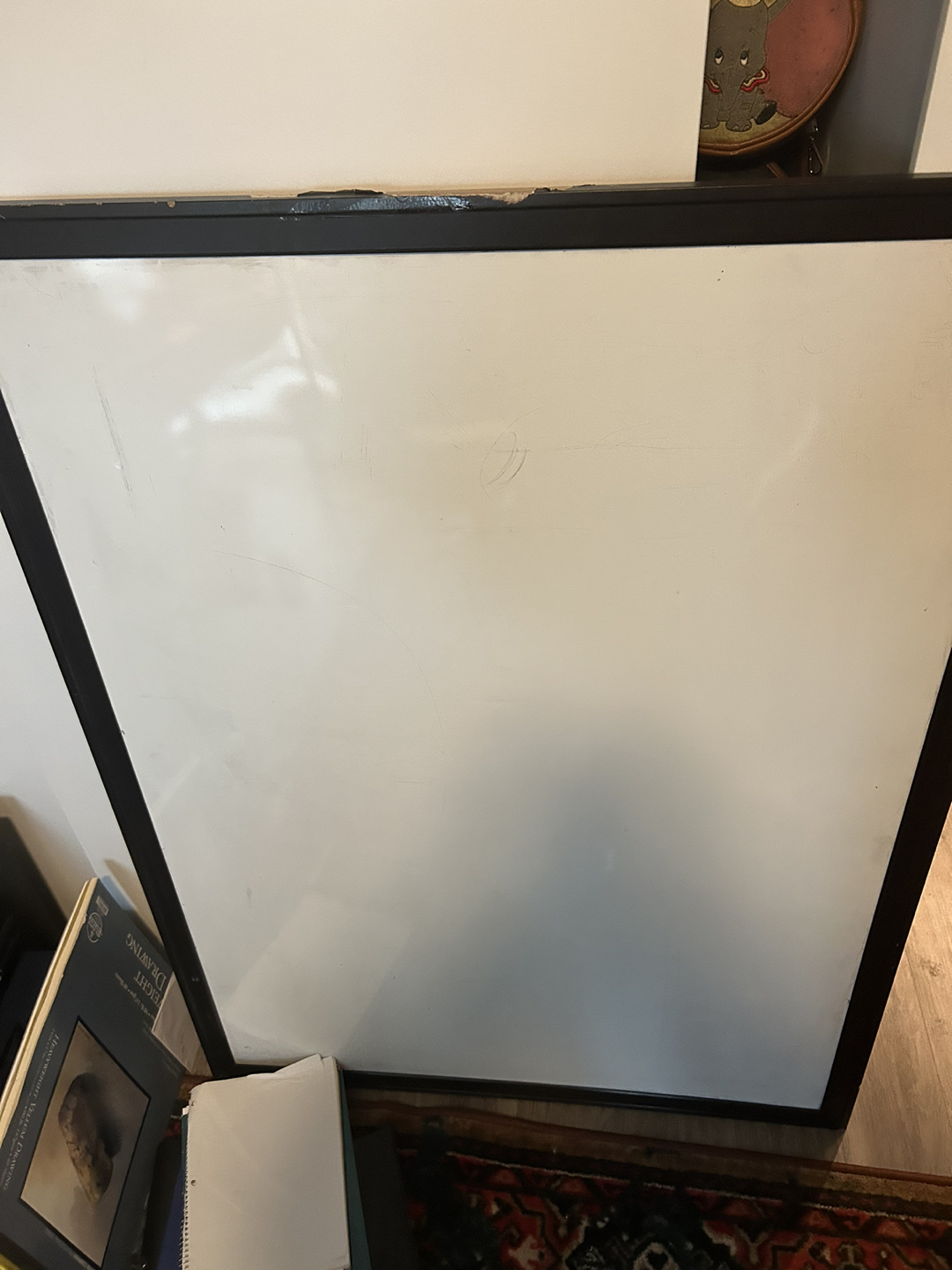Large whiteboard with black wooden border