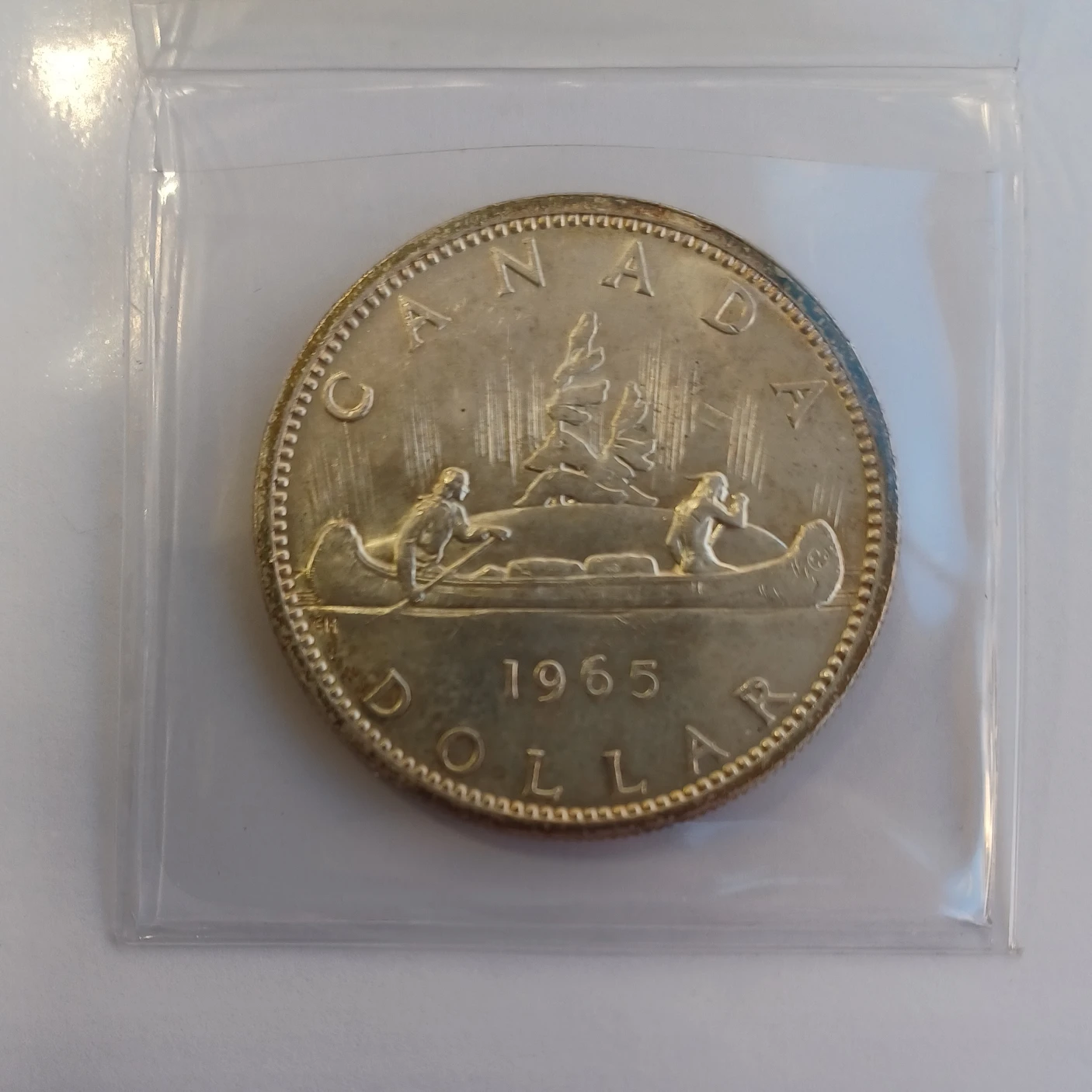 1965 UNC Toned silver dollar coin thumbnail