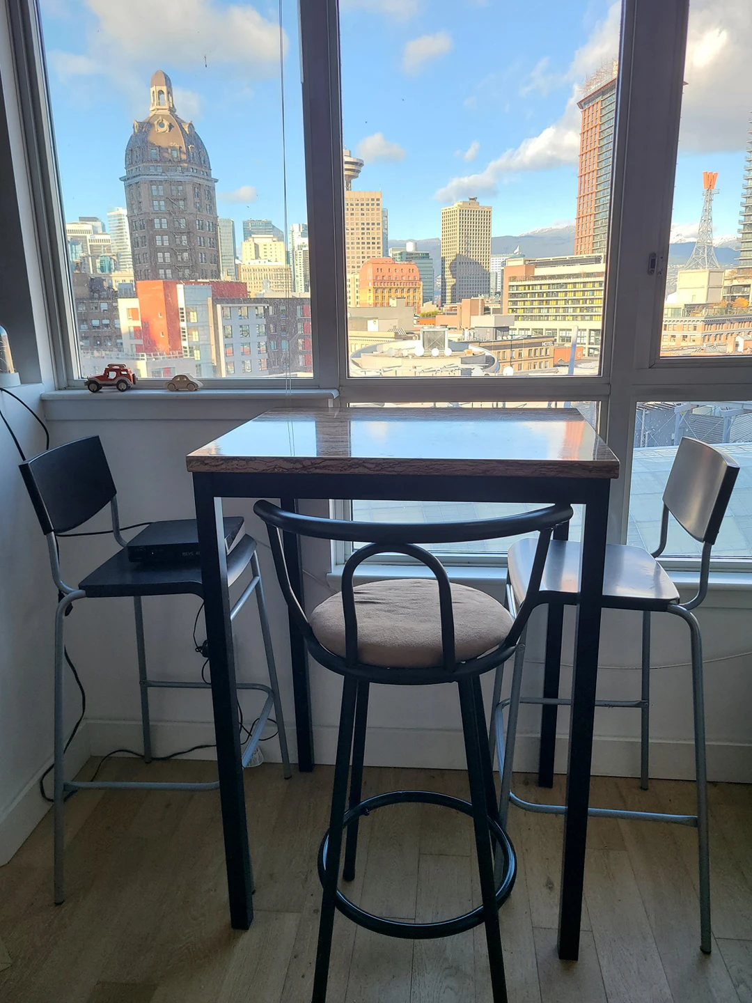 Unique dining table with 3 bar stools