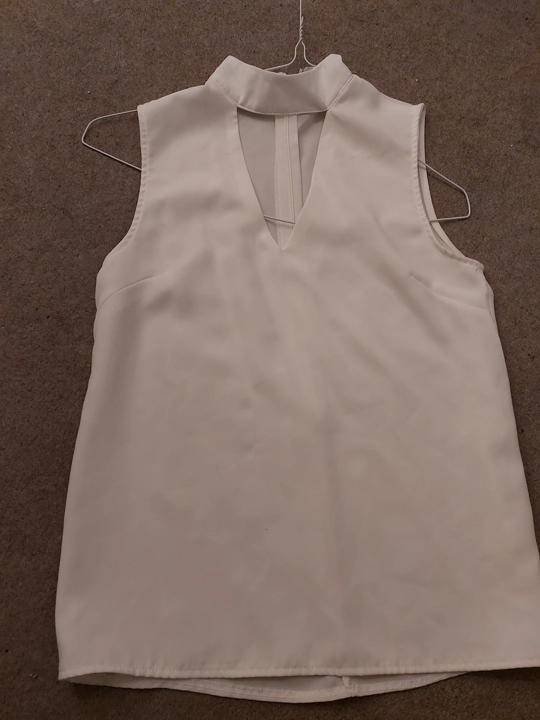 New sleeveless white top