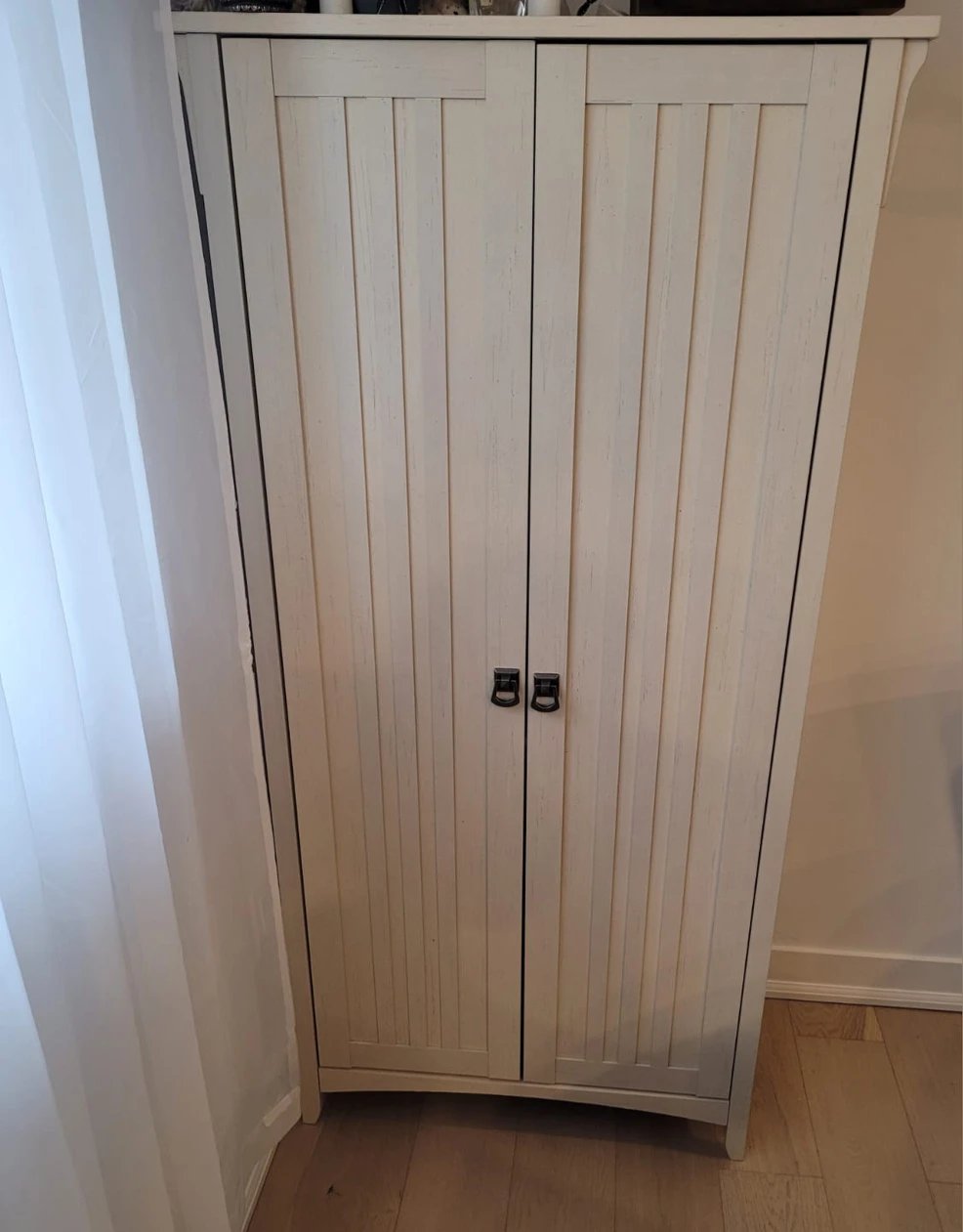 Cream color 2 door pantry thumbnail