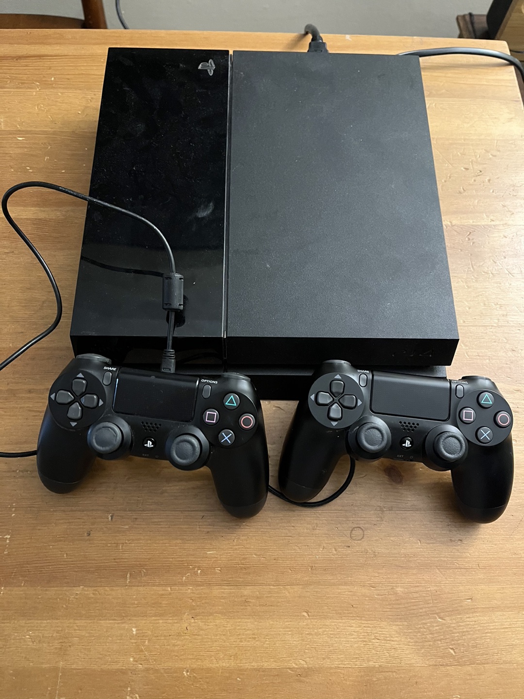 PS4 with 3 controls and 3 games